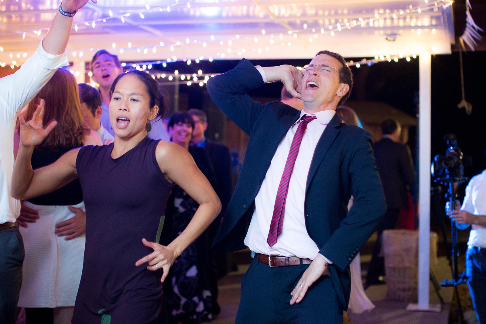 Matt on the dance floor, singing along with one hand behind his head